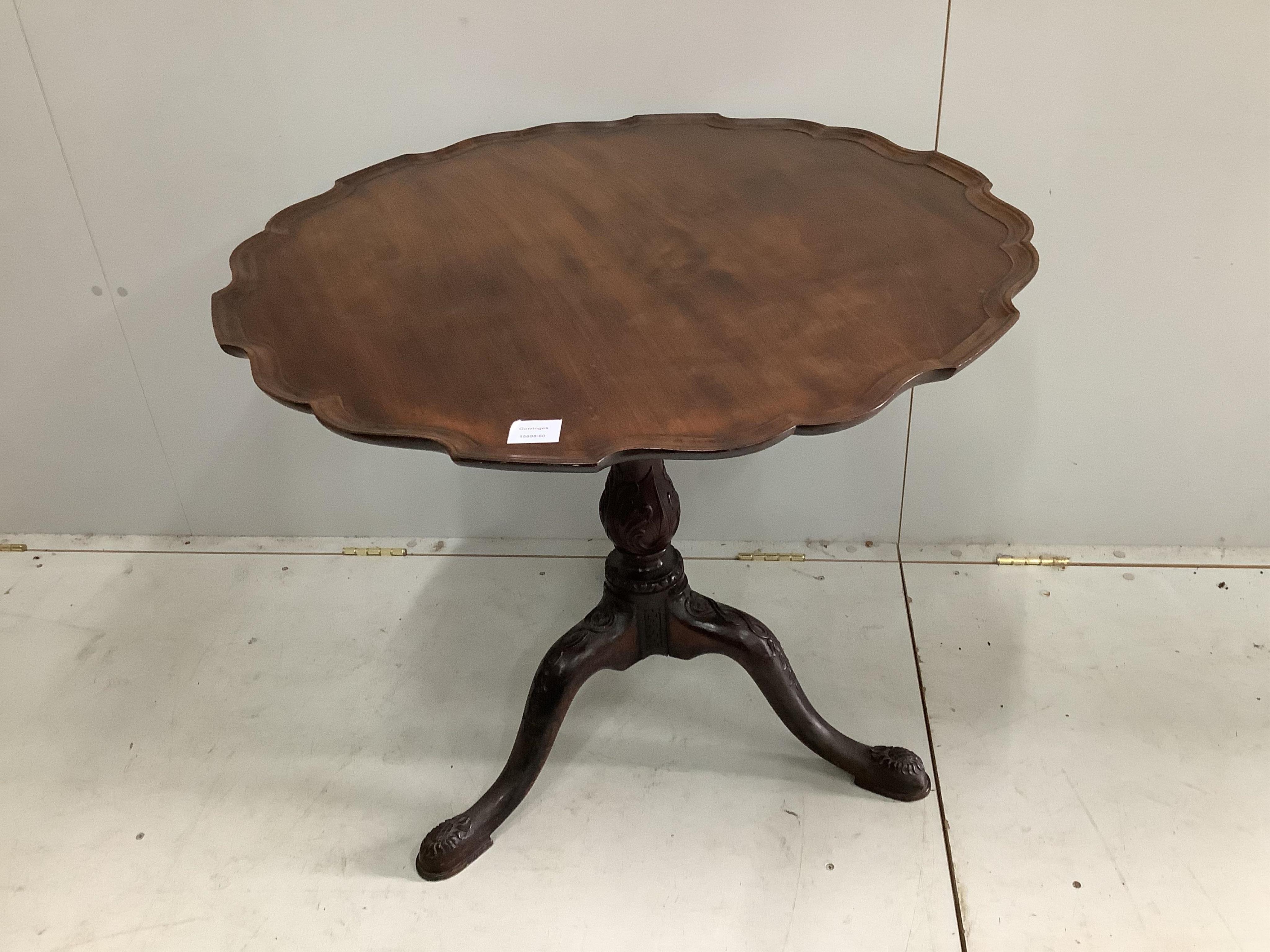 A George III mahogany bird cage tripod table with later piecrust top, diameter 82cm, height 72cm. Condition - top faded, otherwise fair to good